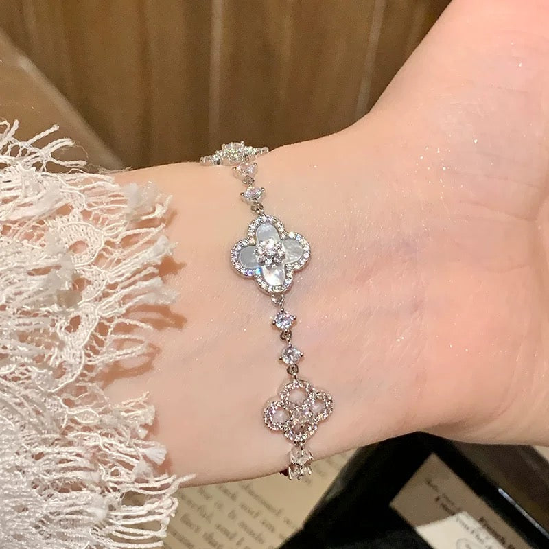 Model wearing Sakura Cleef Bracelet showcasing elegance and style